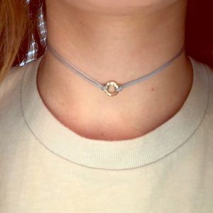 Blue choker with gold jewel